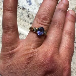 1 carat Tanzanite ring with six diamond baguettes set in 14 carat gold